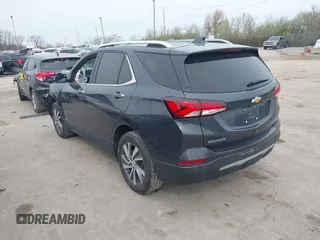 2022 Chevrolet Equinox Premier z VIN 2GNAXXEV9N6124156, wystawiony jako IAAI lot #42015711 z przebiegiem 65 808 mil mil oraz . Historia ofert i sprzedaży dostępna na DreamBid. Obrazek 3.