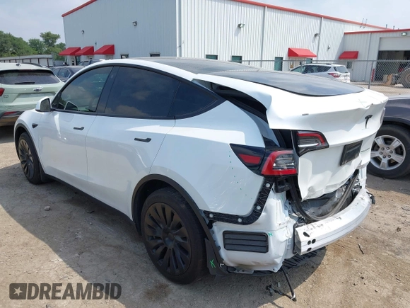 2023 Tesla Model Y Long Range with VIN 7SAYGAEEXPF776370, listed as a IAAI auction lot 42127512 with 27,120 mi miles and . Bid and sale history available at DreamBid. Image 3.