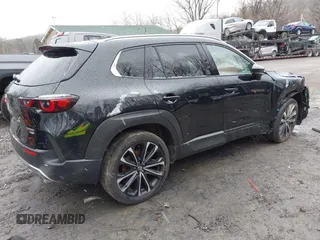 2024 Mazda CX-50 Premium z VIN 7MMVABDYXRN180263, wystawiony jako IAAI lot #41738791 z przebiegiem 9 688 mil mil oraz . Historia ofert i sprzedaży dostępna na DreamBid. Obrazek 4.
