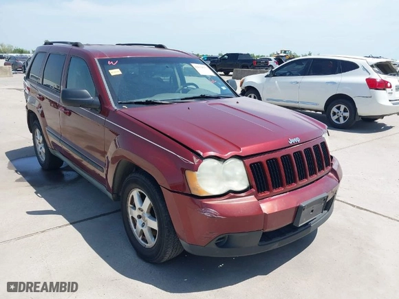 2009 Jeep Grand Cherokee Laredo with VIN 1J8GS48K39C521160, listed as a IAAI auction lot 42039577 with 262,829 mi miles. Bid and sale history available at carsss.com. Image 1.