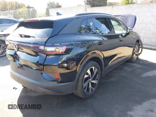 2023 Volkswagen ID.4 Pro z VIN 1V2DNPE85PC028748, wystawiony jako IAAI lot #41348983 z przebiegiem 7 434 mil mil oraz . Historia ofert i sprzedaży dostępna na DreamBid. Obrazek 4.