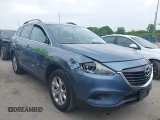 2015 Mazda CX-9 Touring with VIN JM3TB3CV9F0463819, listed as a IAAI auction lot 42506237 with 207,418 mi miles and . Bid and sale history available at DreamBid. Image 1.