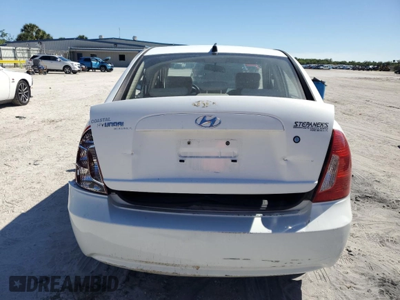 2006 Hyundai Accent GLS with VIN KMHCN46CX6U016680, listed as a Copart auction lot 48881085 with 49,262 mi miles and Salvage Title. Bid and sale history available at carsss.com. Image 6.