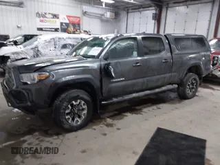 2016 Toyota Tacoma SR5 with VIN 3TMDZ5BNXGM009423, listed as a IAAI auction lot 41008068 with 107,426 mi miles and . Bid and sale history available at DreamBid. Image 2.