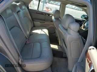 2003 Cadillac DeVille DTS z VIN 1G6KF579X3U233215, wystawiony jako Copart lot #48636775 z przebiegiem 99 144 mil mil oraz Nie do naprawy. Historia ofert i sprzedaży dostępna na DreamBid. Obrazek 10.