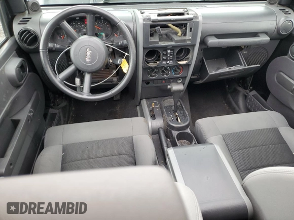2008 Jeep Wrangler Unlimited X with VIN 1J4GA391X8L528349, listed as a Copart auction lot 57086935 with 134,061 mi miles and Salvage title. Bid and sale history available at DreamBid. Image 8.