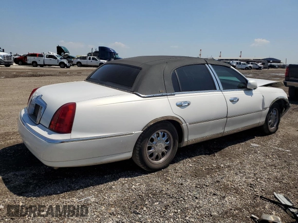 2001 Lincoln Town Car Cartier z VIN 1LNHM83W91Y728971, wystawiony jako Copart lot #50643965 z przebiegiem Nie podano mil oraz Szkoda całkowita • Salvage title. Historia ofert i sprzedaży dostępna na DreamBid. Obrazek 3.