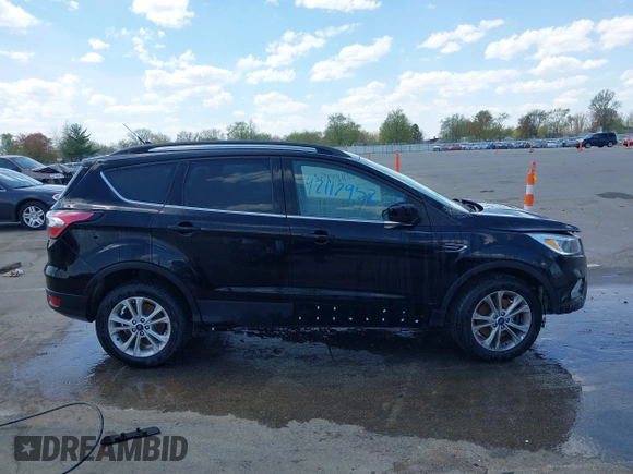 2018 Ford Escape SE z VIN 1FMCU9GD1JUD48846, wystawiony jako IAAI lot #42112952 z przebiegiem 117 580 mil mil oraz . Historia ofert i sprzedaży dostępna na DreamBid. Obrazek 13.