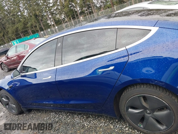 2019 Tesla Model 3 Long Range with VIN 5YJ3E1EB8KF512950, listed as a IAAI auction lot 41836349 with 55,607 mi miles and . Bid and sale history available at DreamBid. Image 14.