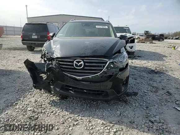 2016 Mazda CX-5 Touring z VIN JM3KE4CY0G0667171, wystawiony jako Copart lot #51579005 z przebiegiem 39 487 mil mil oraz Szkoda całkowita • Salvage title. Historia ofert i sprzedaży dostępna na DreamBid. Obrazek 12.