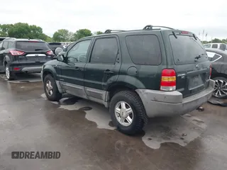 2001 Ford Escape XLT with VIN 1FMCU03101KC25039, listed as a IAAI auction lot 41900122 with 218,126 mi miles. Bid and sale history available at carsss.com. Image 3.
