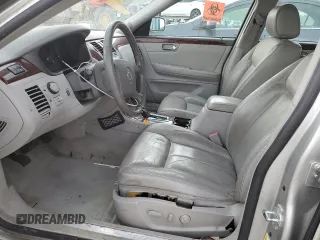 2006 Cadillac DTS 1SD z VIN 1G6KD57Y26U115094, wystawiony jako Copart lot #53534355 z przebiegiem 126 631 mil mil oraz Szkoda całkowita • Salvage title. Historia ofert i sprzedaży dostępna na DreamBid. Obrazek 7.