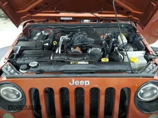 2014 Jeep Wrangler Sport with VIN 1C4AJWAG7EL197285, listed as a Copart auction lot 63451105 with 141,547 mi miles and Salvage title. Bid and sale history available at DreamBid. Image 12.