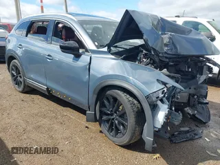 2023 Mazda CX-9 Grand Touring with VIN JM3TCBDY2P0636002, listed as a IAAI auction lot 42055322 with 35,168 mi miles and . Bid and sale history available at DreamBid. Image 1.