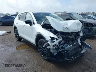 2022 Mazda CX-5 2.5 Turbo with VIN JM3KFBAY5N0524251, listed as a IAAI auction lot 41591692 with 28,493 mi miles and . Bid and sale history available at carsss.com. Image 1.