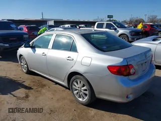 2009 Toyota Corolla with VIN JTDBL40E999021621, listed as a IAAI auction lot 41636462 with 123,650 mi miles. Bid and sale history available at carsss.com. Image 3.
