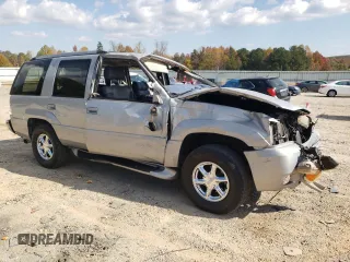 2000 GMC Denali z VIN 1GKEK13R2YR138523, wystawiony jako Copart lot #77609804 z przebiegiem 203 514 mil mil oraz Szkody całkowita. Historia ofert i sprzedaży dostępna na DreamBid. Obrazek 4.