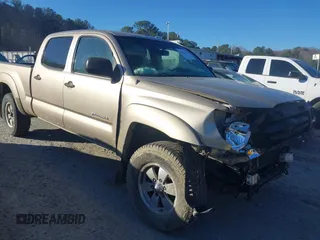 2005 Toyota Tacoma PreRunner with VIN 3TMKU72N75M001102, listed as a IAAI auction lot 41105774 with 233,167 mi miles. Bid and sale history available at carsss.com. Image 1.