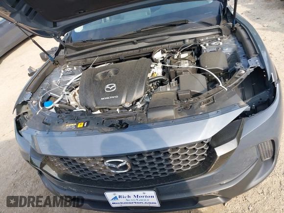 2024 Mazda CX-50 S Premium z VIN 7MMVABDM7RN231991, wystawiony jako IAAI lot #42481427 z przebiegiem 7 843 mil mil oraz . Historia ofert i sprzedaży dostępna na DreamBid. Obrazek 10.