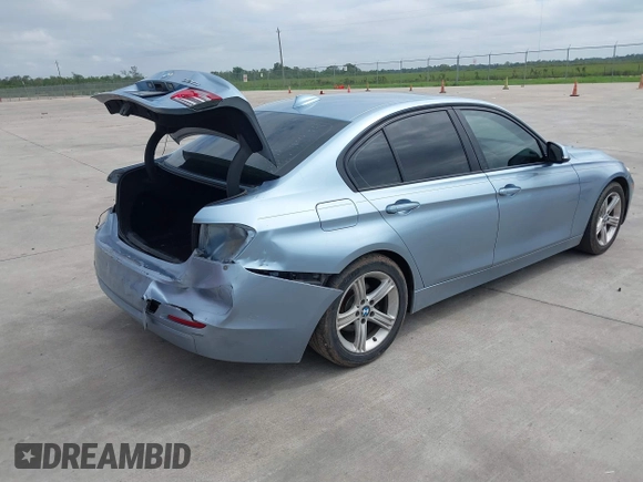 2013 BMW 3 Series 320i with VIN WBA3B1C54DK128284, listed as a IAAI auction lot 40315808 with 136,104 mi miles. Bid and sale history available at carsss.com. Image 4.