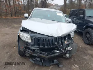 2013 Jeep Grand Cherokee Laredo with VIN 1C4RJFAGXDC537367, listed as a IAAI auction lot 41906921 with 124,679 mi miles. Bid and sale history available at carsss.com. Image 12.