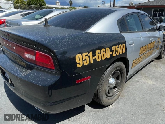 2012 Dodge Charger Police with VIN 2C3CDXAG0CH295515, listed as a Copart auction lot 51870315 with 128,837 mi miles and Clean Title. Bid and sale history available at carsss.com. Image 4.