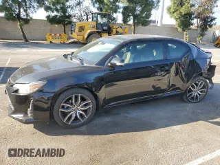 2016 Scion tC with VIN JTKJF5C79GJ020110, listed as a Copart auction lot 86995214 with 79,165 mi miles and Salvage Title. Bid and sale history available at carsss.com. Image 1.