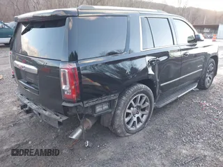 2016 GMC Yukon Denali with VIN 1GKS2CKJ2GR412201, listed as a IAAI auction lot 41185716 with 124,421 mi miles. Bid and sale history available at carsss.com. Image 4.
