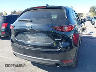 2017 Mazda CX-5 Touring with VIN JM3KFACL2H0146213, listed as a IAAI auction lot 41626112 with 77,829 mi miles and . Bid and sale history available at carsss.com. Image 4.