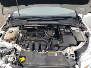2013 Ford Focus SE z VIN 1FADP3F25DL204052, wystawiony jako Copart lot #57662695 z przebiegiem 124 916 mil mil oraz Szkoda całkowita • Salvage title. Historia ofert i sprzedaży dostępna na DreamBid. Obrazek 11.