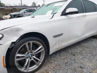 2014 BMW 7 Series 740i with VIN WBAYA6C51ED144387, listed as a IAAI auction lot 41226638 with 161,448 mi miles. Bid and sale history available at carsss.com. Image 6.