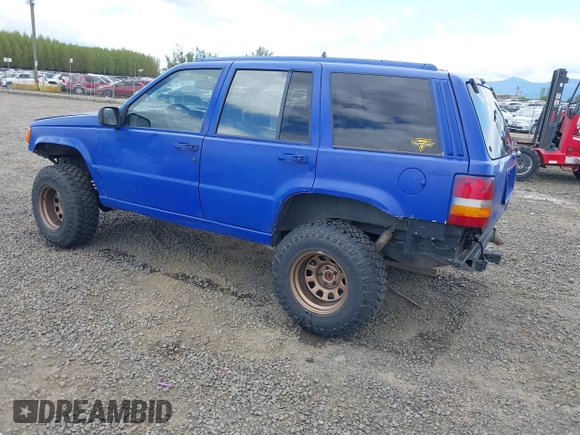 1996 Jeep Grand Cherokee Laredo with VIN 1J4GZ58YXTC329037, listed as a IAAI auction lot 42051175 with 314,571 mi miles and . Bid and sale history available at DreamBid. Image 3.