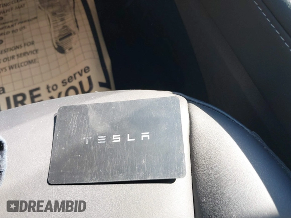 2023 Tesla Model 3 with VIN 5YJ3E1EA9PF585632, listed as a IAAI auction lot 40520993 with 7,775 mi miles and . Bid and sale history available at DreamBid. Image 11.