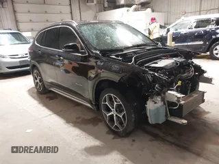 2016 BMW X1 xDrive28i with VIN WBXHT3C33GP886935, listed as a IAAI auction lot 41707367 with 73,201 mi miles. Bid and sale history available at carsss.com. Image 1.