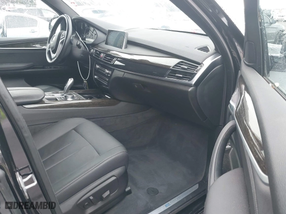 2018 BMW X5 xDrive40e iPerformance with VIN 5UXKT0C54J0V99573, listed as a IAAI auction lot 41490567 with 50,650 mi miles. Bid and sale history available at carsss.com. Image 5.