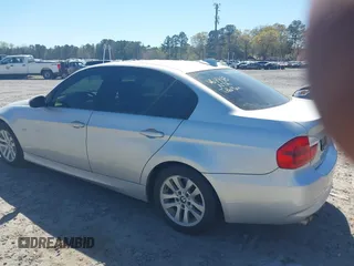 2007 BMW 3 Series 328i with VIN WBAVA33597PV64448, listed as a IAAI auction lot 41874952 with 203,284 mi miles. Bid and sale history available at carsss.com. Image 3.