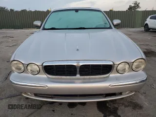 2004 Jaguar XJ with VIN SAJEA71C54SG01326, listed as a Copart auction lot 77449324 with 72,935 mi miles and Salvage Title. Bid and sale history available at carsss.com. Image 5.