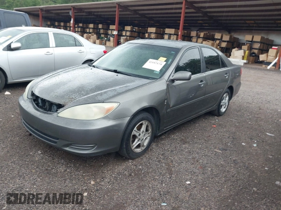 2004 Toyota Camry LE with VIN 4T1BE30K24U921028, listed as a IAAI auction lot 42187174 with 295,174 mi miles and . Bid and sale history available at DreamBid. Image 2.