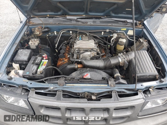 2001 Isuzu Rodeo with VIN 4S2CM57WX14307912, listed as a Copart auction lot 72416784 with 170,522 mi miles and Salvage title. Bid and sale history available at DreamBid. Image 12.