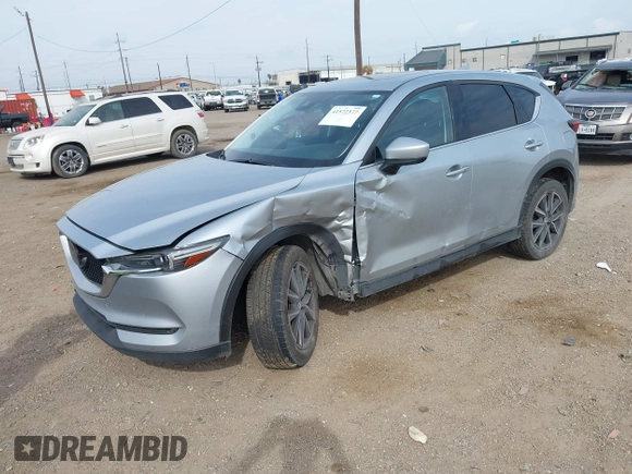 2017 Mazda CX-5 Grand Touring with VIN JM3KFBDL8H0227348, listed as a IAAI auction lot 41572377 with 124,908 mi miles. Bid and sale history available at carsss.com. Image 17.