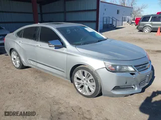 2014 Chevrolet Impala LTZ with VIN 2G1155S32E9282710, listed as a IAAI auction lot 41250424 with 154,486 mi miles. Bid and sale history available at carsss.com. Image 1.