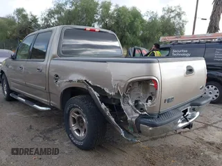 2003 Ford F-150 XLT with VIN 1FTRW07623KD34295, listed as a IAAI auction lot 41515387 with 163,506 mi miles. Bid and sale history available at carsss.com. Image 3.
