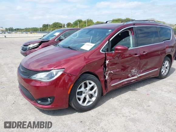 2017 Chrysler Pacifica Touring L with VIN 2C4RC1BG6HR739602, listed as a IAAI auction lot 42085250 with 96,377 mi miles and . Bid and sale history available at DreamBid. Image 17.