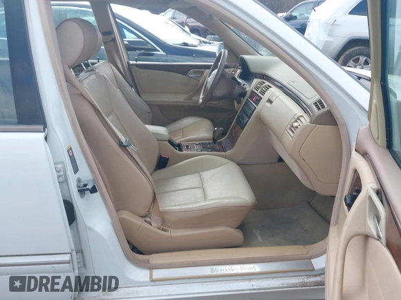 2001 Mercedes-Benz E-Class AWD with VIN WDBJH82J61X057506, listed as a IAAI auction lot 41506666 with 304,332 mi miles. Bid and sale history available at carsss.com. Image 5.