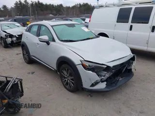 2016 Mazda CX-3 Grand Touring with VIN JM1DKFD7XG0132084, listed as a IAAI auction lot 41004954 with 70,476 mi miles. Bid and sale history available at carsss.com. Image 1.
