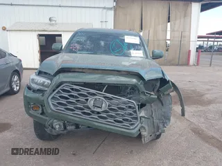 2021 Toyota Tacoma SR z VIN 3TYCZ5AN2MT049069, wystawiony jako IAAI lot #42116964 z przebiegiem 96 275 mil mil oraz . Historia ofert i sprzedaży dostępna na DreamBid. Obrazek 12.