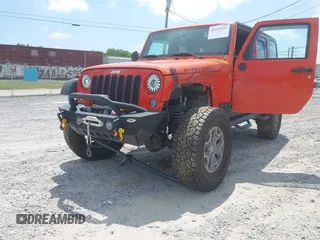 2015 Jeep Wrangler Unlimited Rubicon z VIN 1C4BJWFG4FL598033, wystawiony jako IAAI lot #42435523 z przebiegiem 134 202 mil mil oraz . Historia ofert i sprzedaży dostępna na DreamBid. Obrazek 6.