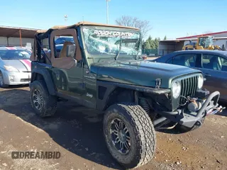 1998 Jeep Wrangler SE with VIN 1J4FY29P6WP709203, listed as a IAAI auction lot 41962877 with 1 mi miles. Bid and sale history available at carsss.com. Image 1.
