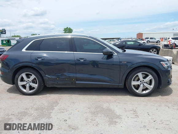 2019 Audi e-tron Premium Plus with VIN WA1LABGE6KB012565, listed as a IAAI auction lot 42220663 with 48,804 mi miles and . Bid and sale history available at DreamBid. Image 6.