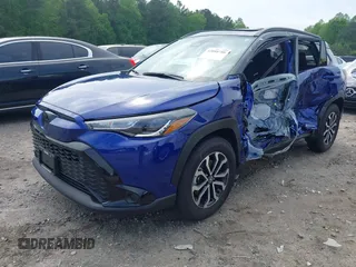 2024 Toyota Corolla Cross Hybrid S with VIN 7MUFBABG2RV042934, listed as a IAAI auction lot 42098911 with 7,613 mi miles and . Bid and sale history available at DreamBid. Image 2.